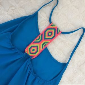 Bright blue tank top. Neon strap back.